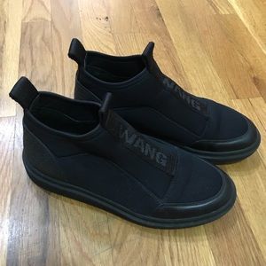 Alexander wang high top black slip on sneakers.